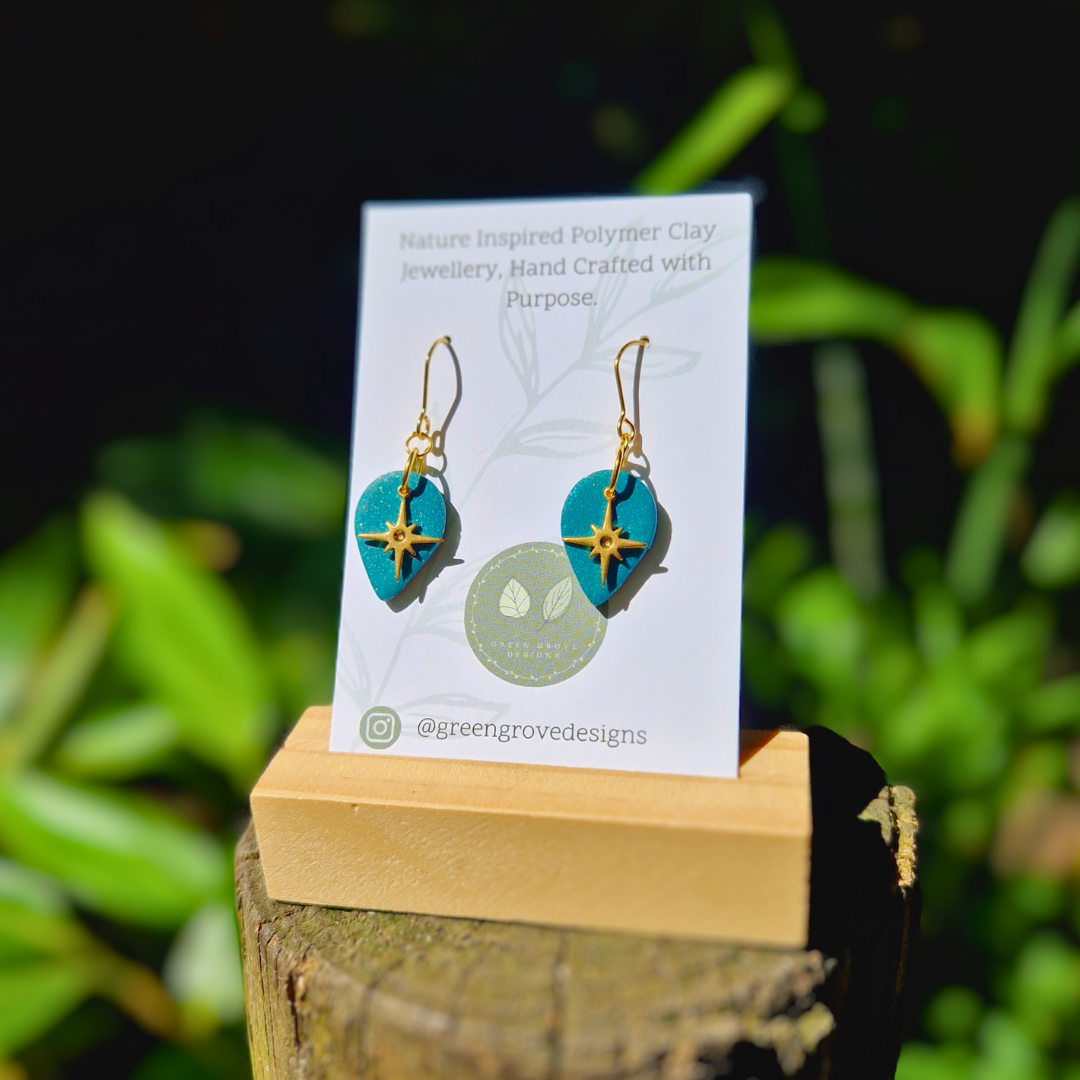 Glitter Green North Star Teardrop Earrings Displayed on Green Grove Designs Packaging