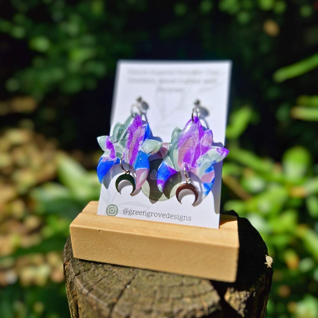 Translucent Polymer Clay and Resin Celestial Drop Studs with Moon Charm Displayed on Green Grove Designs Branding