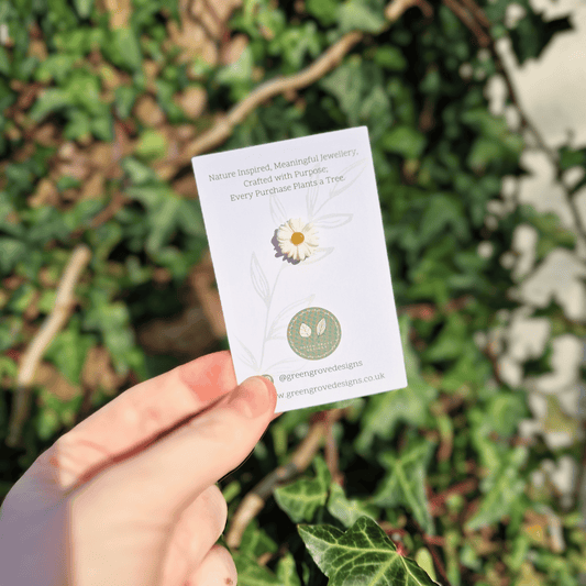 Tiny Intricate Polymer Clay Daisy Pin Hand Crafted in Dorset in Hand for Scale.