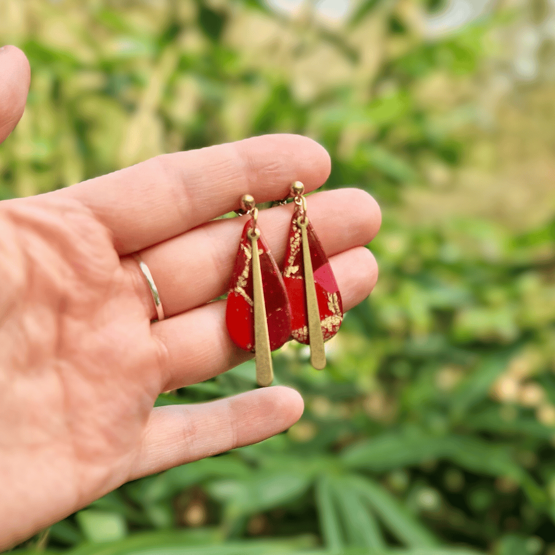 Hand for Scale Image of the Zero Waste Polymer Clay Long Teardrop Studs in Nature Background in Dorset.