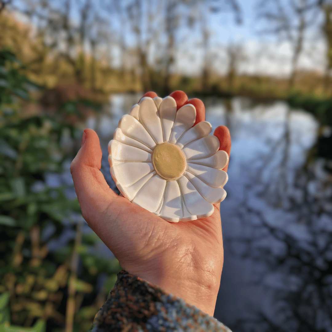 Daisy Polymer Clay Nature Trinket Dish in Hand for Scale with Natural Background.