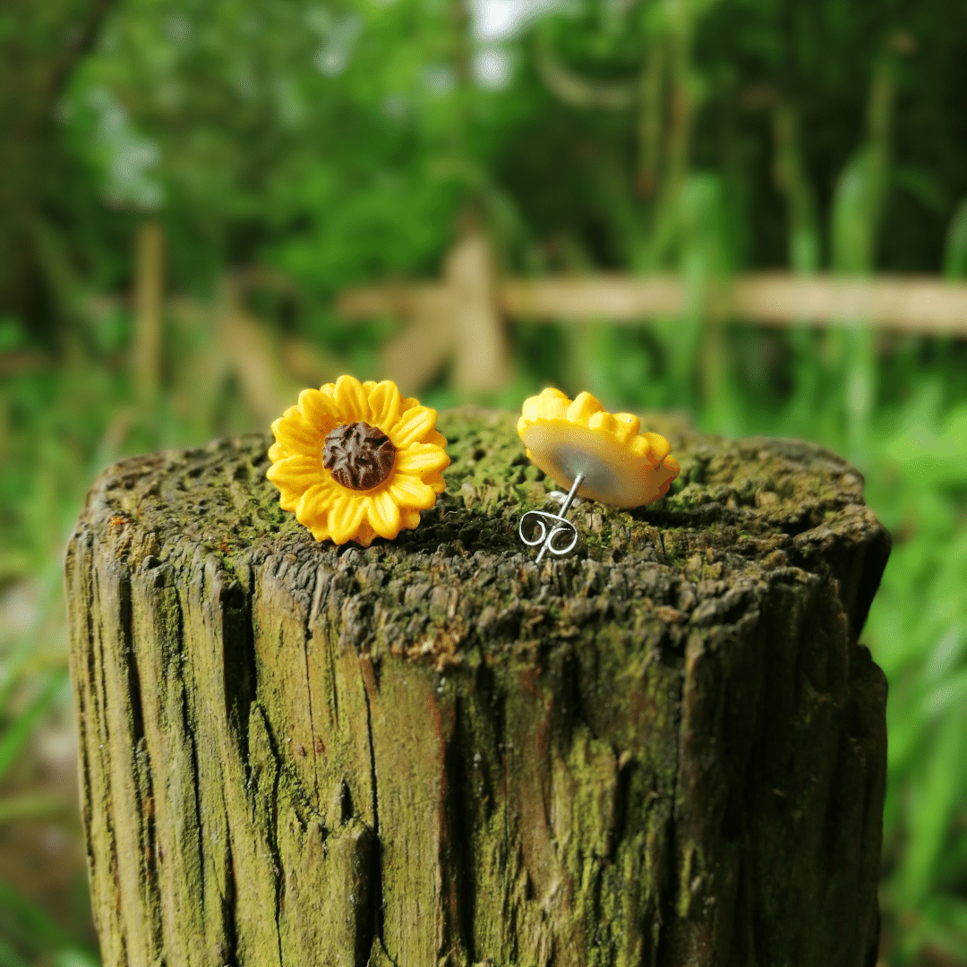 Joyful polymer clay sunflower studs with tarnish resistant hypoallergenic steel posts.