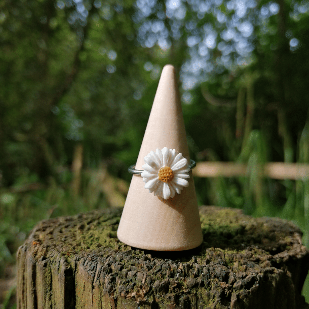 Front View of our Adjustable Intricate Daisy Ring with Nature Background.