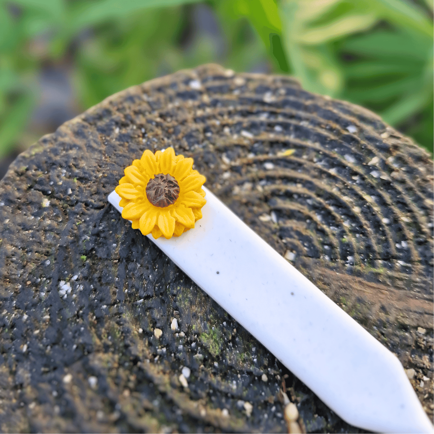 Close up of our Sunflower decorative plant tag, hand crafted using polymer clay in Dorset.