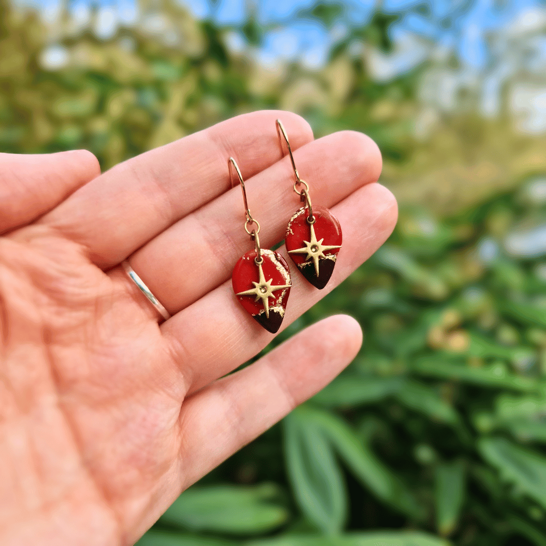 Hand for Scale Image for Option 1 of the Polymer Clay Zero Waste North Star Tear Hooks in Nature Background.