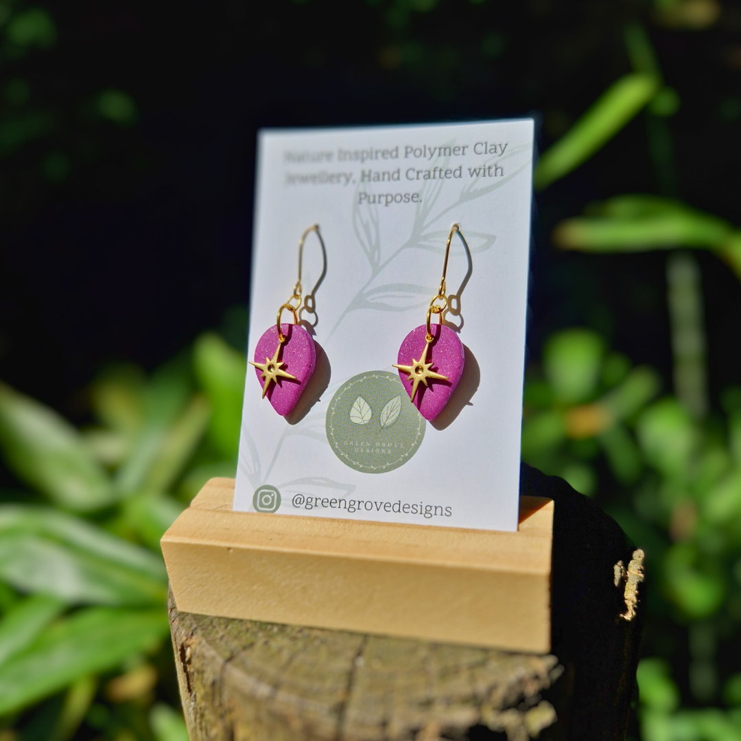 Glitter Purple North Star Teardrop Earrings in Packaging with Nature Background