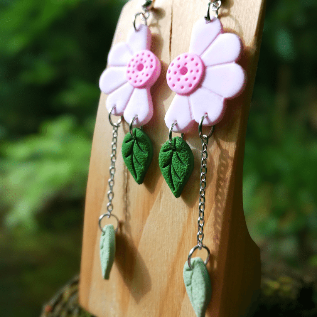 Close Up Image of our Pink Wild Daisy and Leaf Drop Studs, Hand Crafted in Dorset.