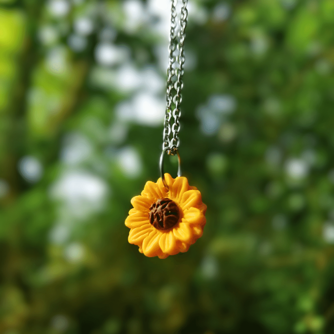 Detailed Sunflower necklace close up, hand crafted in Dorset with polymer clay.