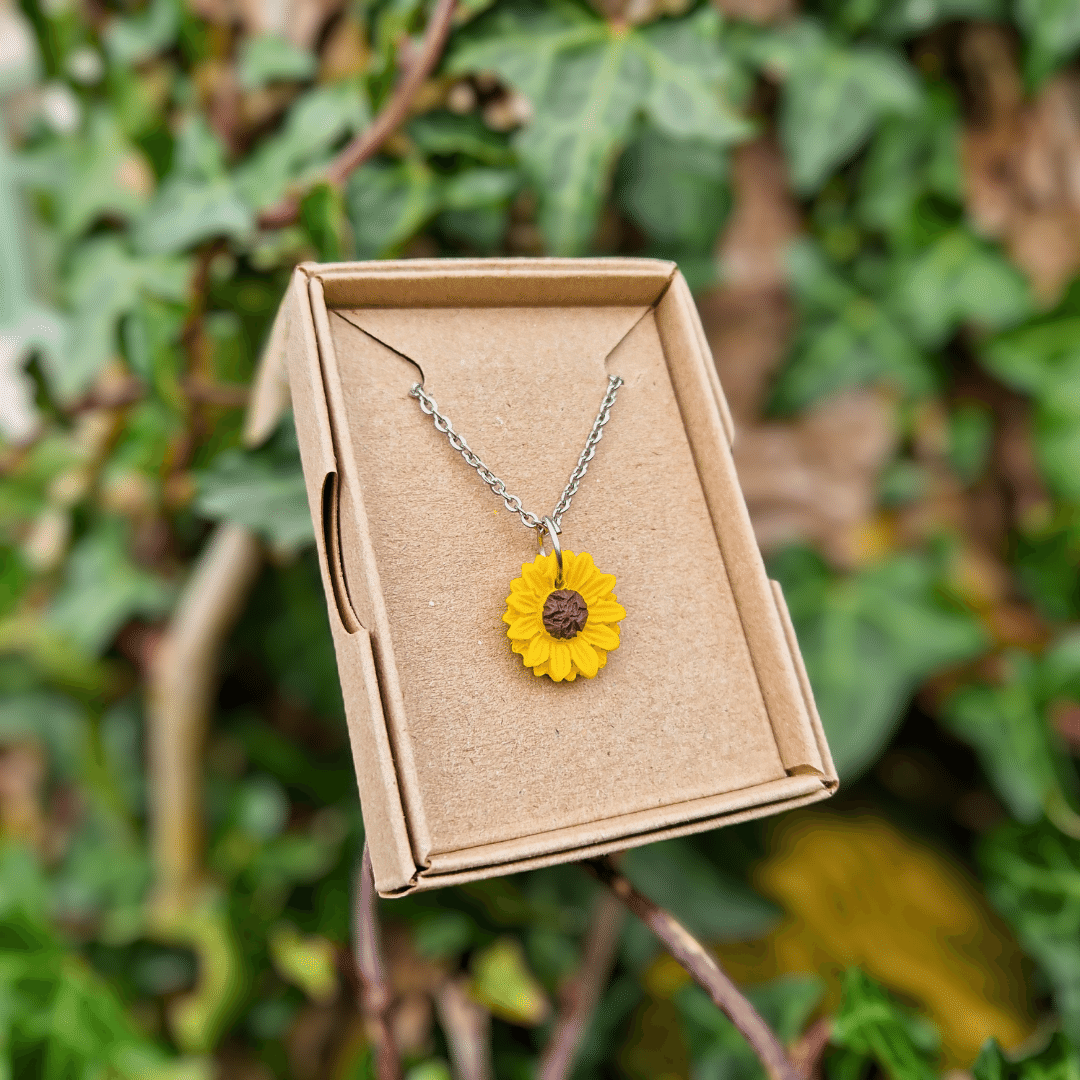 Tarnish resistant and hypoallergenic Sunflower necklace displayed in box.