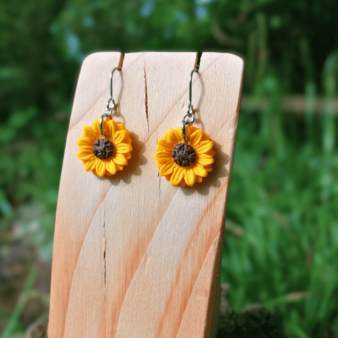 Close up image of our joyful Sunflower hooks with intricate petals, hand crafted in Dorset using polymer clay.