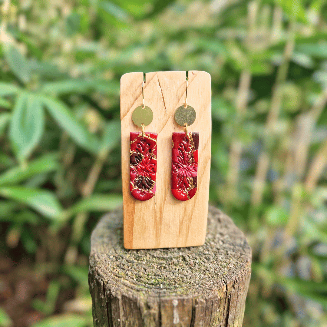 Frontal Image of the Red and Gold Floral Embossed Zero Waste Polymer Clay Hook Earrings.